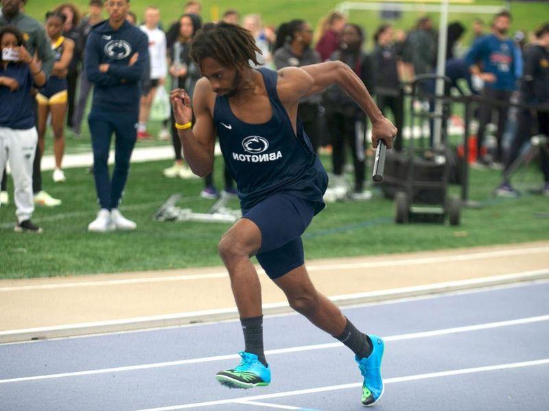 Student running in a track meet